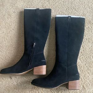 Black suede Ugg riding boots.